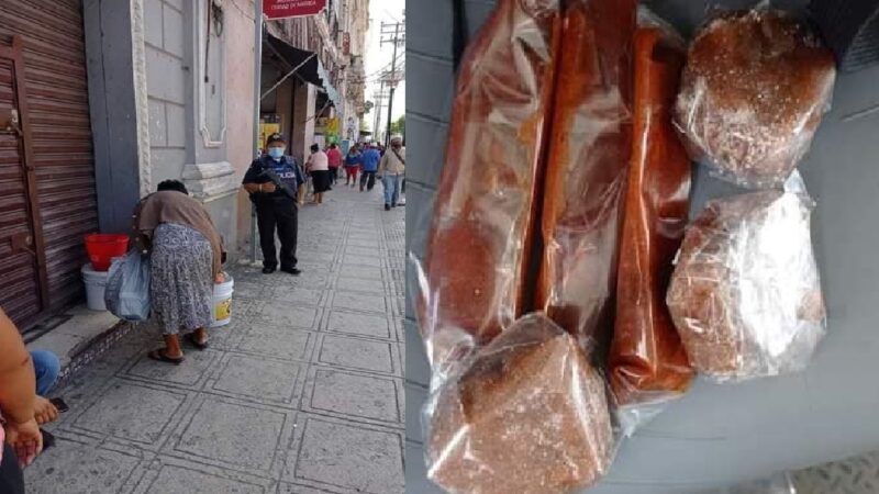 Policías armados retiran a abuelita que vendía pulpas de tamarindo en el centro de Mérida.