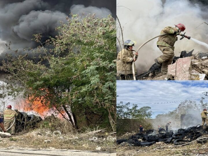 Policías y bomberos apagan un incendio en un depósito de llantas en Kanasín