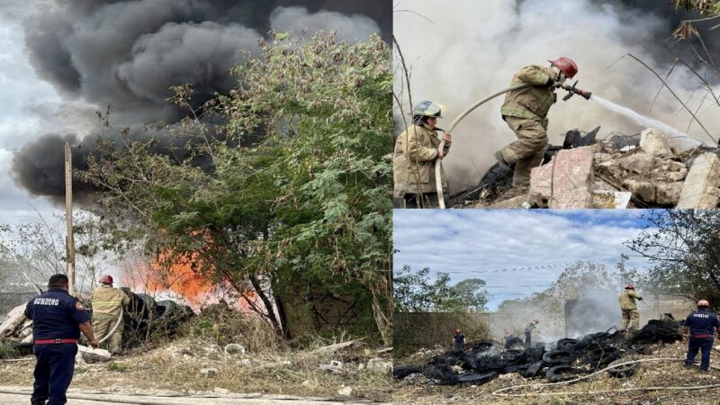Policías y bomberos apagan un incendio en un depósito de llantas en Kanasín